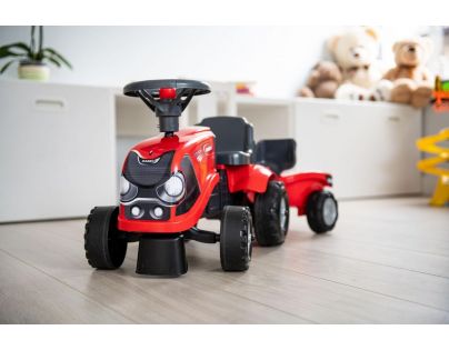 Falk Odstrkovadlo traktor Baby Case IH červený s vlečkou, lopatkou a hrabičkami
