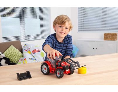 Revell Junior Kit traktor s figurkou 1 : 20 červený